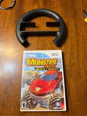 Wii Monster 4x4: World Circuit (Wii) - Black Ubisoft Steering Wheel Included